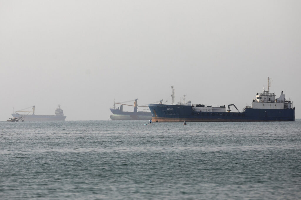 Merchant Ships Desert Strait of Hormuz Amid Renewed US Strikes